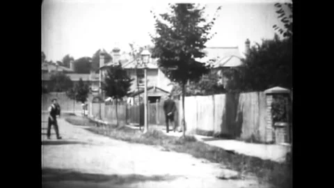 UNITED KINGDOM - 1900 - Two couples cruise in a rickety open car. The car Stock Footage 340585114