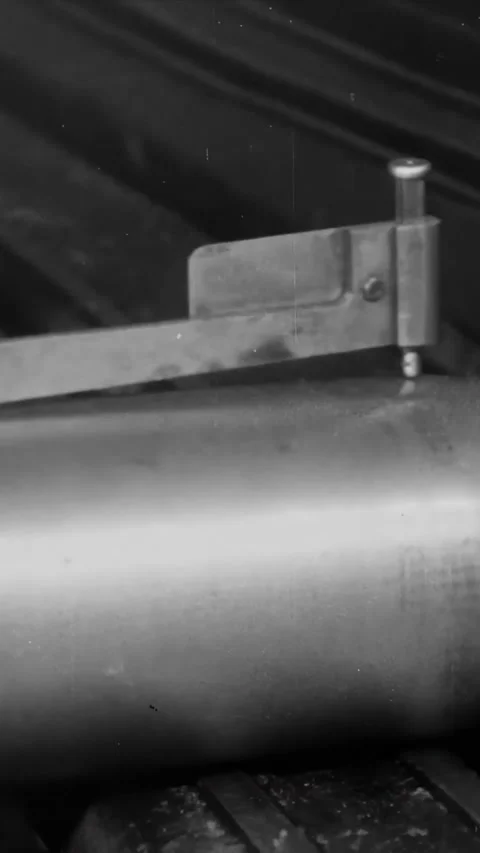 UNITED KINGDOM - 1917 - A Howitzer shell is measured during an inspection at a Stock Footage 340327770