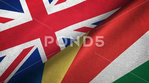 United Kingdom and Seychelles two flags textile cloth, fabric texture Stock Photos
