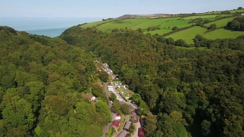 United Kingdom, Devon, Exmoor, Lynton, wooded valley on the north Devon coast Stock Footage 80629851