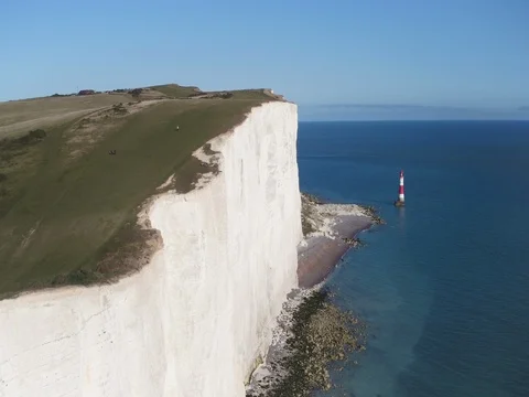 United Kingdom, East Sussex, Eastbourne, Beachy Head lighthouse, Seven Sisters Stock Footage