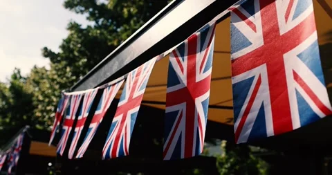 United Kingdom flags waving in the wind during a UK national celebration Stock Footage 338153148