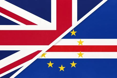 United Kingdom vs Cabo Verde national flag from textile. Stock Photos