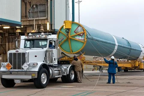 United Launch Alliance (ULA) workers assist as the Delta II first stage is .. Stock Photos