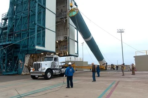 United Launch Alliance (ULA) workers assist as the Delta II first stage is .. Stock Photos