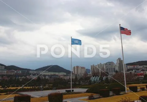 United Nations Flag Waving in the air of UN Memorial Cemetery in Busan, South Stock Photos