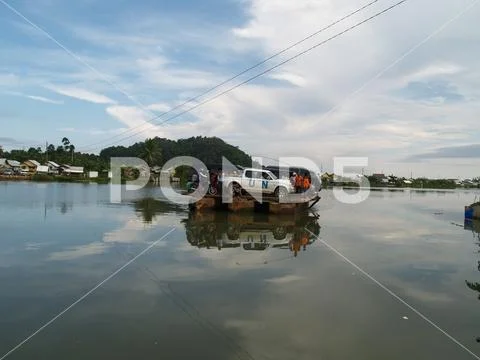 United Nations Vehicle loaded on a raft to crossing over the water bay Stock Photos