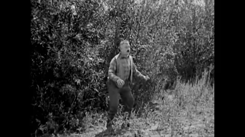 UNITED STATES - 1920 - Roach furiously chases after the couple. They dive into 스톡 동영상 304357004