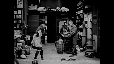 UNITED STATES - 1920 - Roach prepares to punish Louise with a huge rod and 스톡 동영상 304356165