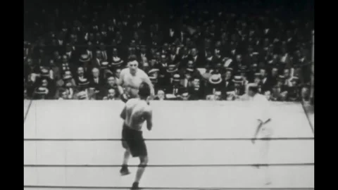 UNITED STATES - 1923 - The referee separates two heavyweight boxers in the Stock Footage 341987905