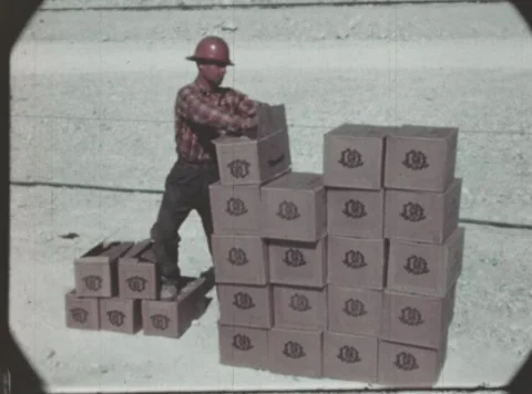 UNITED STATES 1940s: Workers operate heavy industrial drilling machinery in an Stock Footage 337109077