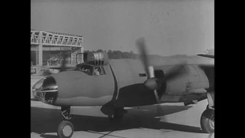 UNITED STATES - 1941: Worker at engine and propeller Stock Footage 342856977