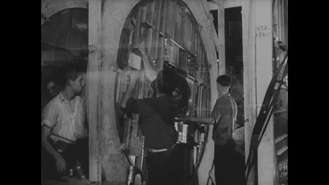 UNITED STATES - 1941: Workers at circular airframe jig Stock Footage 342857088