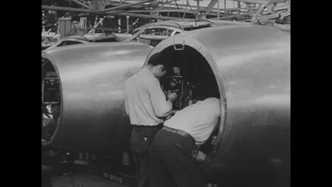 UNITED STATES - 1941: Workers inside open fuselage Video stock 342856983