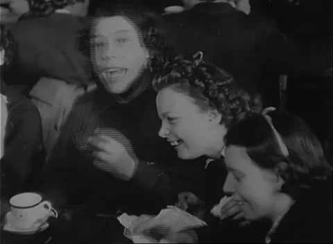 UNITED STATES - 1942: Workforce morale - Standing crowd applauds program 動画素材 344508965
