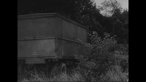UNITED STATES - 1943: Mobile support vehicle - Trailer stands in open field Stock Footage 344508542