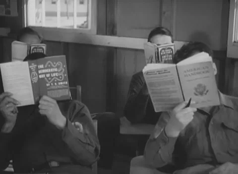 UNITED STATES - 1945: Reading class - Servicemen study printed pamphlets Stock Footage 344509457