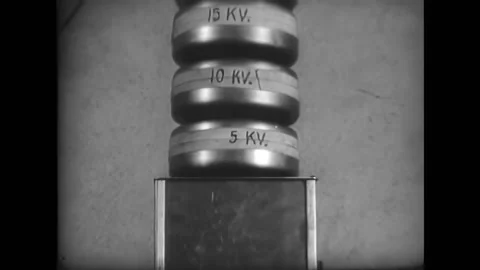 UNITED STATES - 1950 - A stack of capacitors with a wire attached on top Stock Footage 316680014