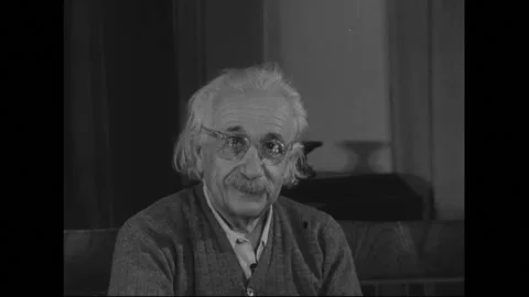 UNITED STATES 1950s: Albert Einstein puts on glasses. Close up of Einstein. Stock Footage 301944627