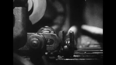 UNITED STATES: 1950s: close up of rollers and components on printing press. Man Stock Footage 75293760