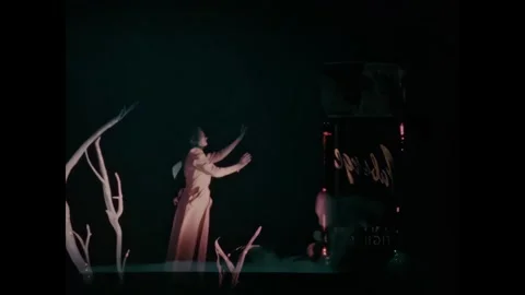 UNITED STATES - 1950s - A dancer wearing a headscarf gracefully dances and moves Stock-Footage 340654053