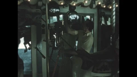 UNITED STATES 1950s: Man pulls a lever, and pulls a string on a bell. The Video stock 309541139