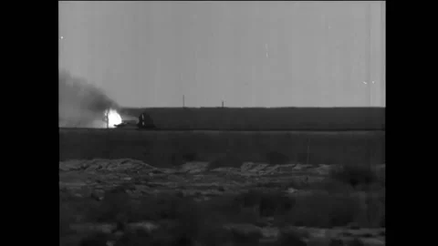 UNITED STATES - 1954 - The rocket sled ignites in flames. Spectators watch Stock Footage 325201741