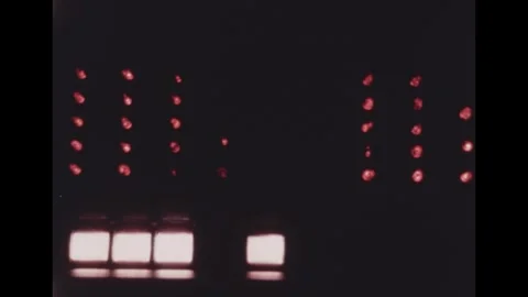 United States 1960s: Blinking computer lights in a darkened room. Видео 329699232