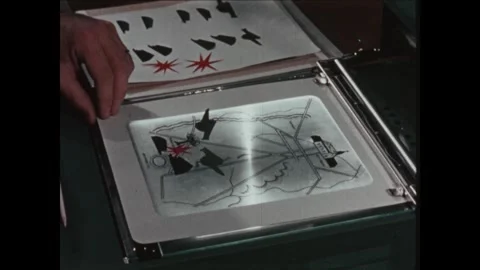 United States 1960s: Man using overhead projector, moving objects on slide. Stock Footage 322142397