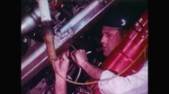 United States 1960S: Man Works On Wires Of Space Rocket On Earth. Man Working  Stock Footage
