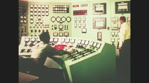 UNITED STATES: 1960s: men in control room. Submarine dives under water. Aircraft Stock Footage