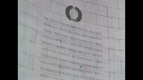 UNITED STATES 1960s: Quote from Declaration of Independence on a wall. People Stock Footage 335723192