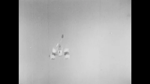 UNITED STATES: 1960s: space module falls from sky on parachute. Lunar module Video stock 76369351