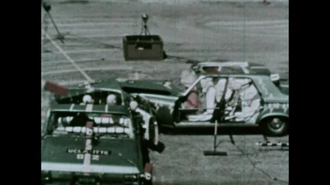 United States 1960s: Testing site.  Cars full of crash test dummies hit each Stock Footage 313909154