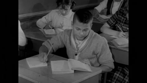 UNITED STATES - 1962 - Elementary students work hard in solving various math Stock Footage 296395962