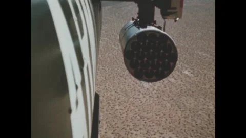 UNITED STATES - 1966: Rocket pod muzzle above passing desert Video stock 341748435