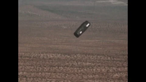 UNITED STATES - 1966: Rocket pod falls to the desert floor Stock Footage 341748612