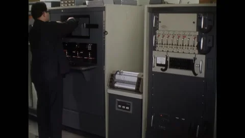 UNITED STATES - 1967 - Technicians stand in front of the BM machine as a reel of Stock Footage 312747432