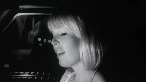 UNITED STATES - 1969 - Candy is driven home by her employer before seducing him. Stock Footage 308629914
