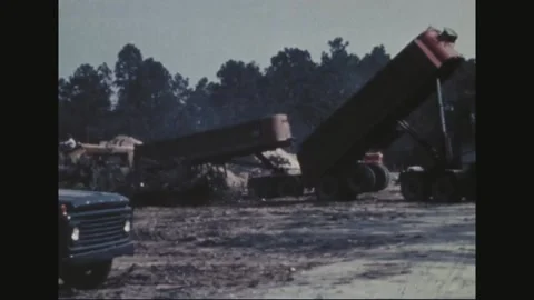 UNITED STATES - 1969: Dump trailer tips load at debris site 库存影片 341813488