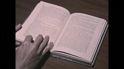 UNITED STATES - 1969 - A hand flips through the pages of Johnny Tremain. Bill's Stock-Footage 301528680