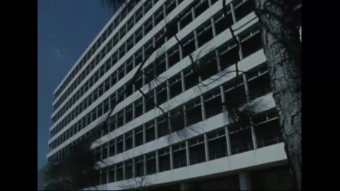 UNITED STATES - 1970: Low angle along a modernist grid facade Stock Footage 341851345