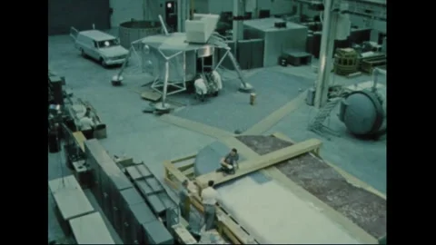 UNITED STATES - 1970: Lunar Module mock-up across a shop floor 動画素材 341851425