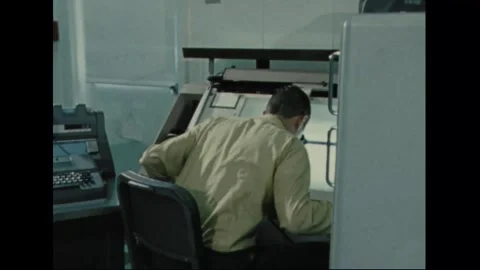 UNITED STATES - 1970: Operator at a large plotting instrument Stock Footage 341851267