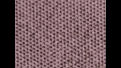 UNITED STATES - 1970s - An atomic microscope magnifies a mineral slice into Stock Footage 340665188