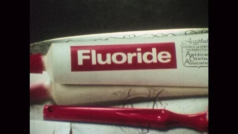 UNITED STATES 1970s: Close up of toothpaste, zoom out to dental products on tray Vídeo Stock 75171579