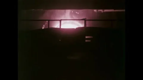 UNITED STATES - 1970s - Fire blasting from a furnace in a steel mill. Molten Stock Footage 340665178