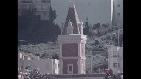 United States 1970s: Man at a drafting table. Ghirardelli Square. Clock tower. Stock Footage 322177458