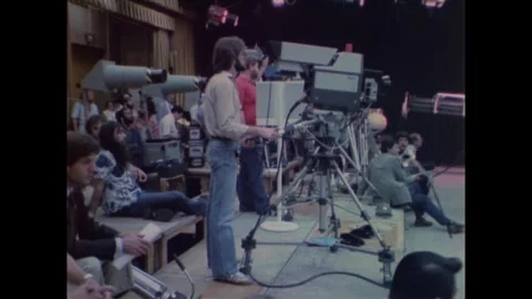 United States 1970s: Media coverage of a NASA press event. Camera operators film Stock Footage 323969310