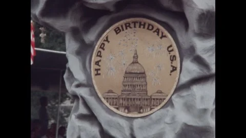 United States 1970s: Parade float with cliff and sign reading Happy Birthday Stock Footage 323326326